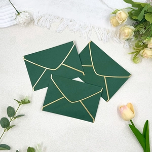 Three-piece dark green envelope set with gold foil edging and elegant V-flap design
