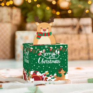Close-up of a green Christmas candy box featuring a 3D reindeer decor and festive patterns