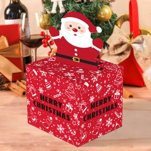 Macro detail of red Christmas candy box featuring a 3D Santa Claus and festive patterns