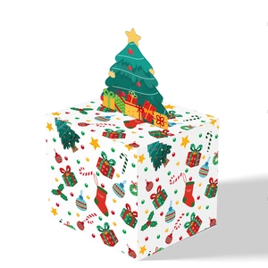 Macro detail of Christmas candy box with pop-up tree and festive holiday patterns