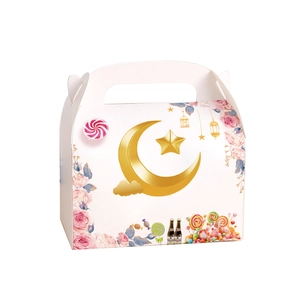 Close-up of white paper gift box with gold moon stars and floral print details