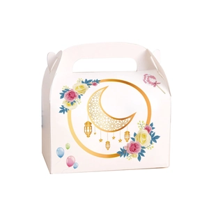Detail of white festive gift box with golden moon and floral patterns for celebrations