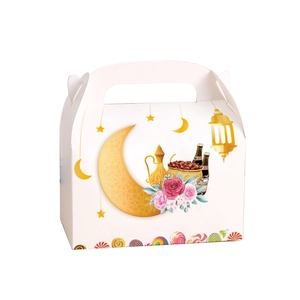 Close-up of Ramadan gift box with gold moon stars and flowers for Eid party candies