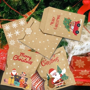 Brown kraft Christmas envelopes with festive illustrations and snowflake stickers