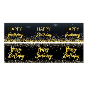 Detail of black and gold happy birthday water bottle labels with glitter star patterns