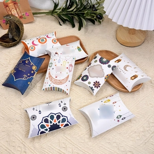 Detail of crescent moon pillow candy boxes with mandala patterns and hanging lanterns
