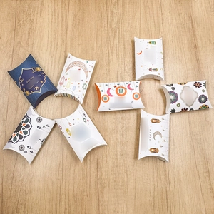 Close-up of moon and star pattern pillow candy boxes for festive party favors