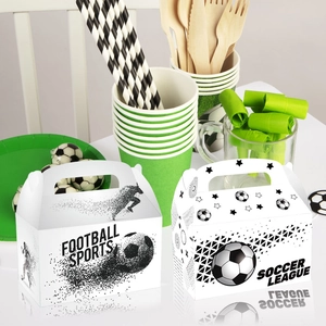 Football theme party gift boxes with Soccer League designs on a green stadium table