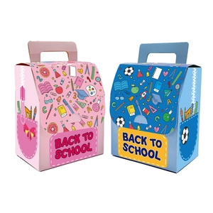 Detail of school bag shaped favor boxes in pink and blue for Back to School parties