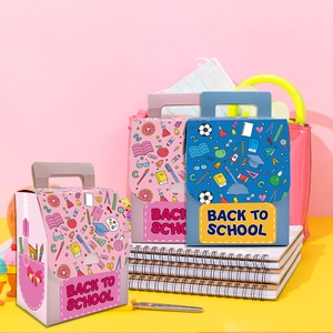 Three colorful Back to School paper candy boxes with school supply patterns and handles