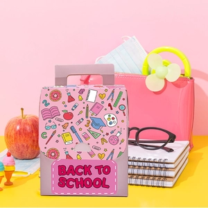 Detailed close-up of pink Back to School gift box with stationery illustrations and handle