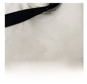 Close-up of thick canvas fabric texture and Fashion Bag print on a crossbody tote