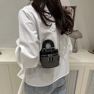 Mini cylindrical bucket bag with black leather and houndstooth woven texture finish