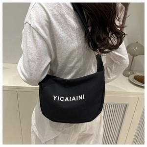 Detailed back view of a black crescent nylon crossbody bag with YICAIAINI branding
