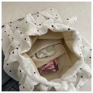 Internal view of floral tote bag showing spacious lining and secure zipper pocket