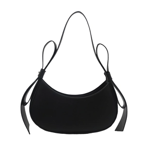 Minimalist black crescent shoulder bag with knotted strap and smooth leather finish