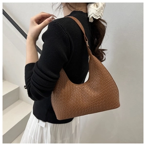 Brown crocodile pattern faux leather hobo shoulder bag styled with elegant outfit