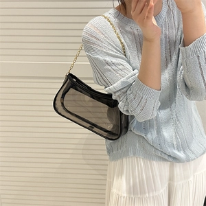 Minimalist black transparent PVC underarm baguette bag with golden chain strap for women
