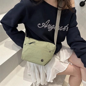Japanese style canvas crossbody bag in light green nylon with adjustable strap