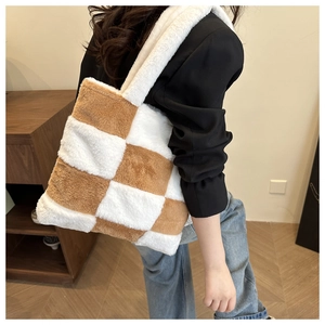 Brown and white checkered plush tote bag shown on model for size and style reference
