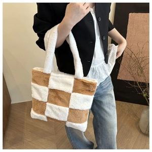 Detail of soft plush tote bag with brown and white checkerboard pattern in casual setting
