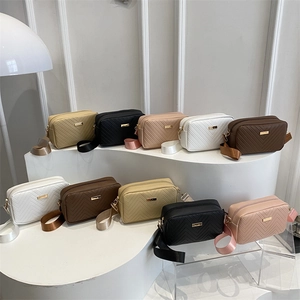 Summer 2025 quilted crossbody bags in multiple colors with wide fabric straps