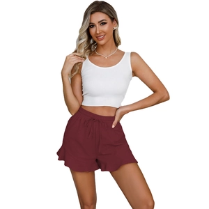 Women's summer two-piece set with white ribbed tank top and maroon ruffled drawstring shorts