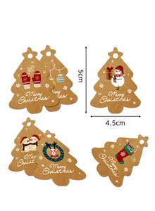 Detailed view of Christmas tree shaped kraft gift tags with snowman and reindeer patterns
