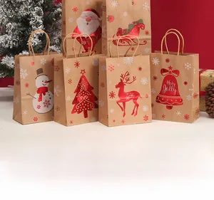 Detail of Christmas kraft paper gift bags with metallic foil reindeer and snowman patterns