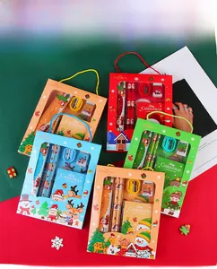 Macro detail of Christmas stationery set with pencils and notebook in holiday packaging