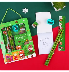 Christmas stationery gift set featuring festive pencils, ruler, eraser, and mini notebook