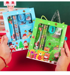 Detail of Christmas stationery set gift box featuring pencils, ruler, and festive designs