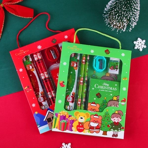 Christmas stationery gift set featuring pencils and notebooks in a festive red box