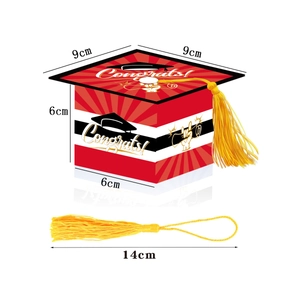 Detail view of graduation cap gift box with golden tassel and Congrats text