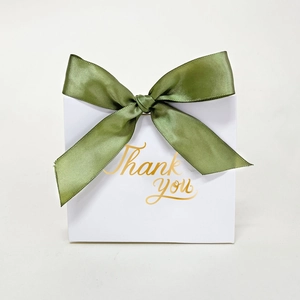 White wedding favor box with green satin bow and gold foil Thank You lettering