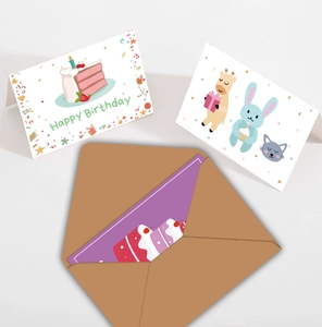 Detail of cartoon birthday cards with animal illustrations and brown kraft envelope