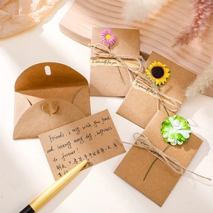 DIY vintage kraft paper envelopes with dried flowers and twine for birthday and Mother's Day