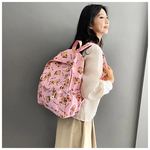 Side view of pink casual backpack with cute cartoon Capybara print and mesh pocket