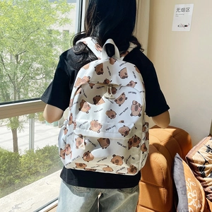 White large capacity backpack with cute all-over capybara print and front pocket