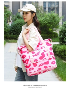 Pink leopard print travel bag featuring a bottom expansion zipper and spacious storage