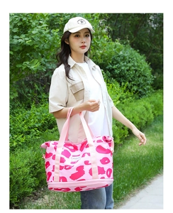 Pink leopard print travel bag with bottom shoe compartment and large capacity design