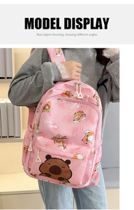 Detail of pink backpack with cute capybara print and white triangular zipper pulls