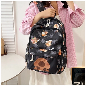 Detail showing high-capacity black backpack with cute capybara patterns and white zippers