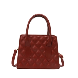 Classic wine red quilted leather crossbody bag with top handles and golden hardware