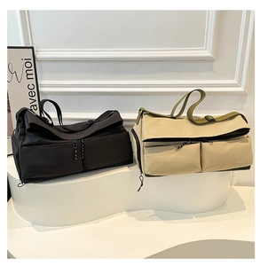 Detail of travel fitness bags showing dual front zipper pockets and durable nylon fabric
