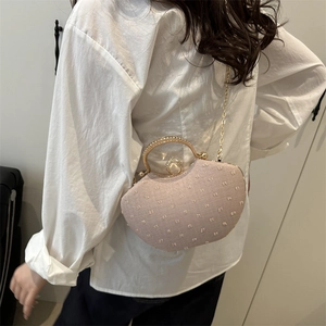 Fashionable light pink evening clutch bag with gold rhinestone handle and chain strap