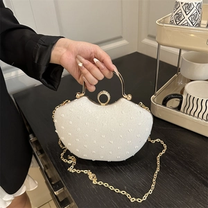 Minimalist white textured fan-shaped handbag with gold chain strap and crystal buckle