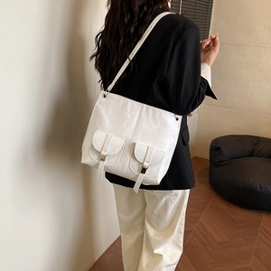 Minimalist white large-capacity tote bag with dual front pockets and adjustable strap