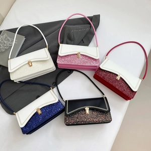 Five assorted sequin fashion handbags with metal locks and leather straps in a fan arrangement