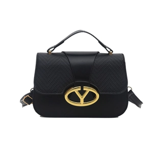 Black leather handbag with gold V-buckle closure and adjustable strap on white background
